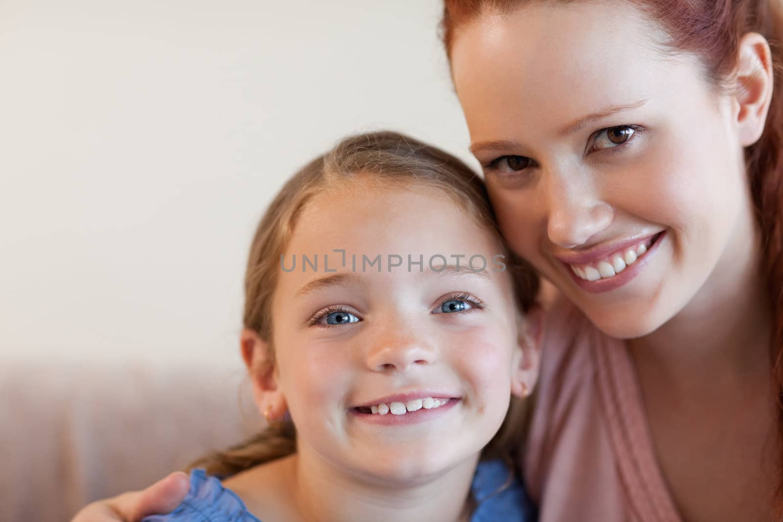 Cheerful smiling mother and daughter