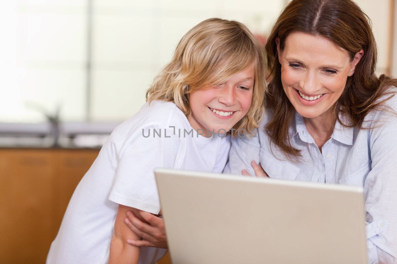Woman and her son with laptop