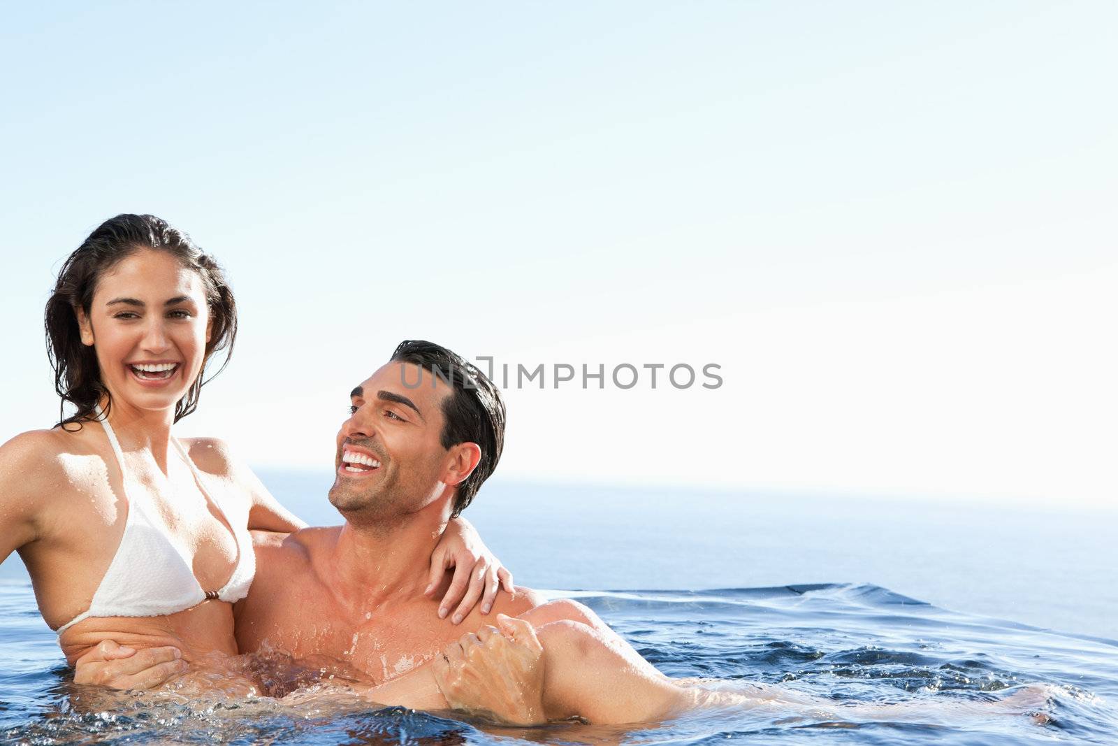 Couple enjoying their time together in the pool