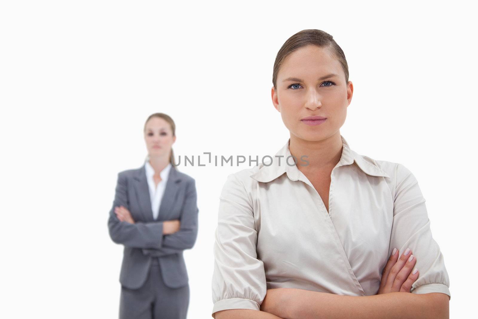 Two businesswomen posing against a white background