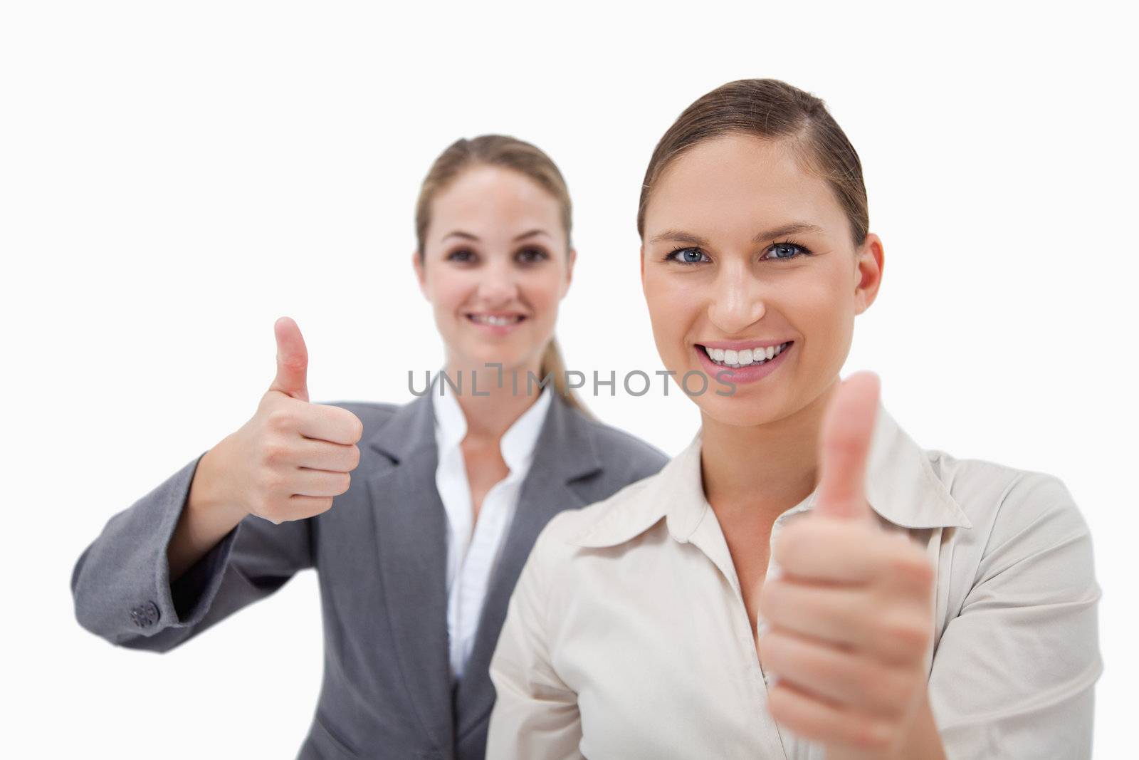 Sales persons posing with the thumb up against a white background