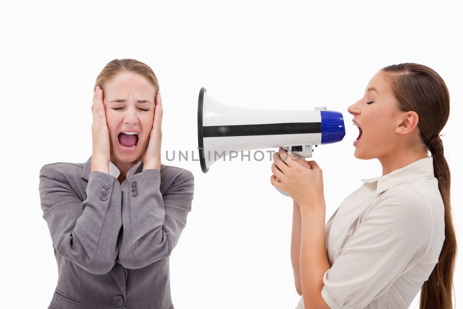 Young manager yelling at her employee through a megaphone against a white background