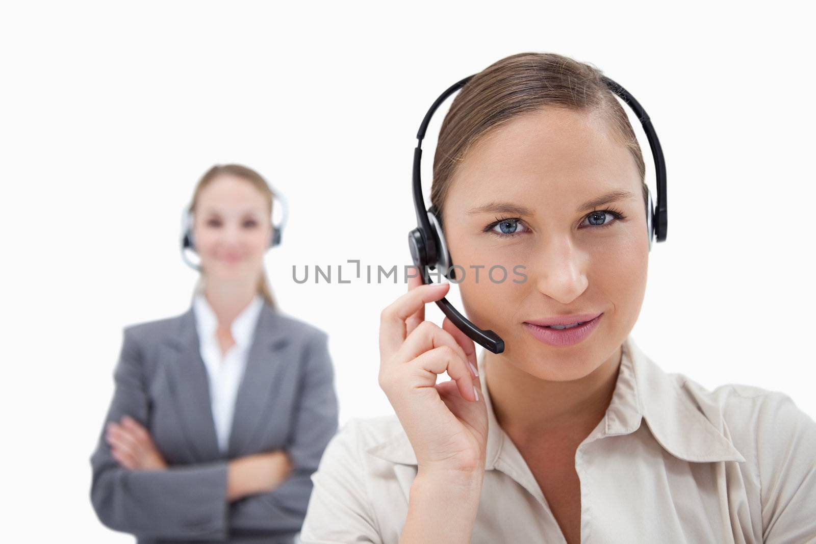 Beautiful operators with headsets against a white background