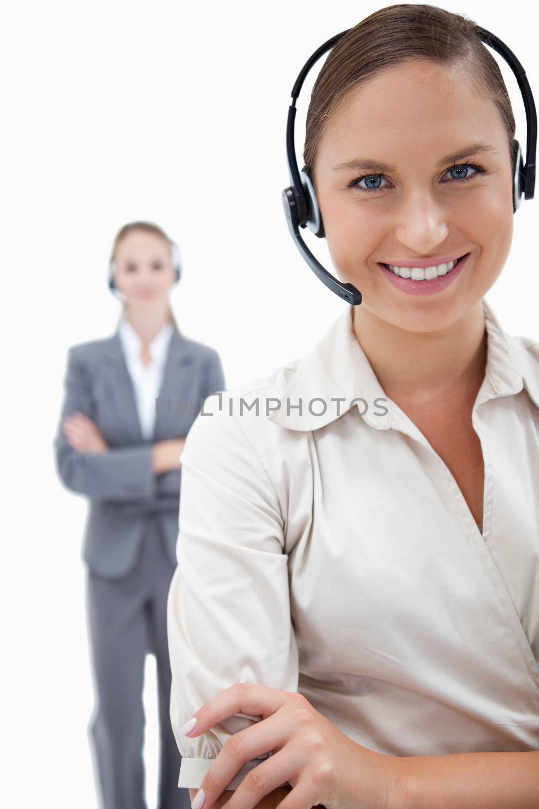 Portrait of operators with headsets against a white background