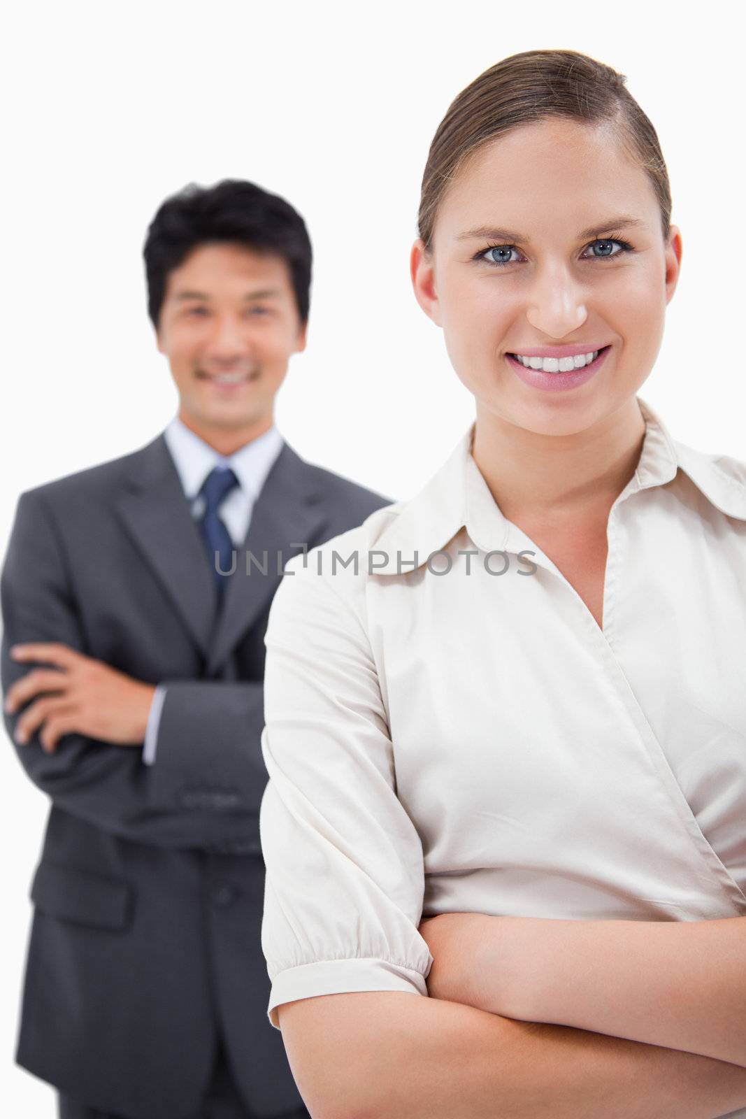 Portrait of smiling business people posing with the arms crossed