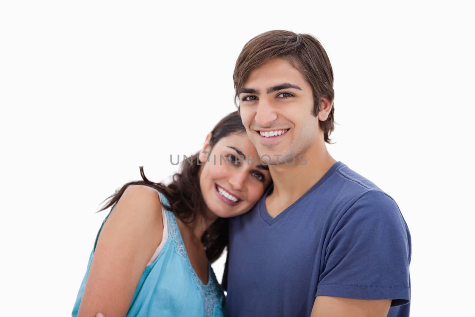 Lovely couple embracing each other against a white background