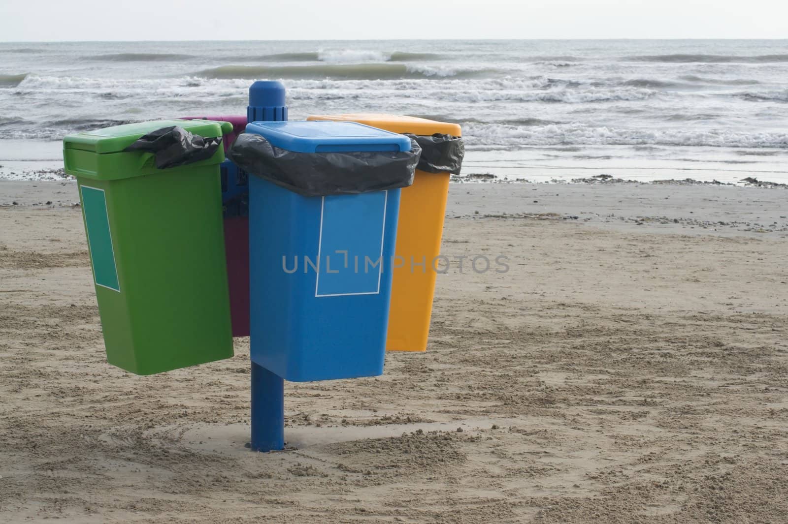 Garbage cans on the beach in Cervia in Italy