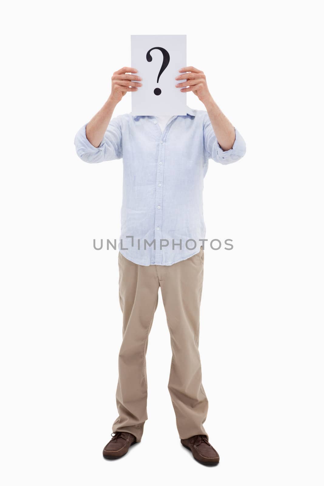 Portrait of a man holding a question mark on a paper against a white background
