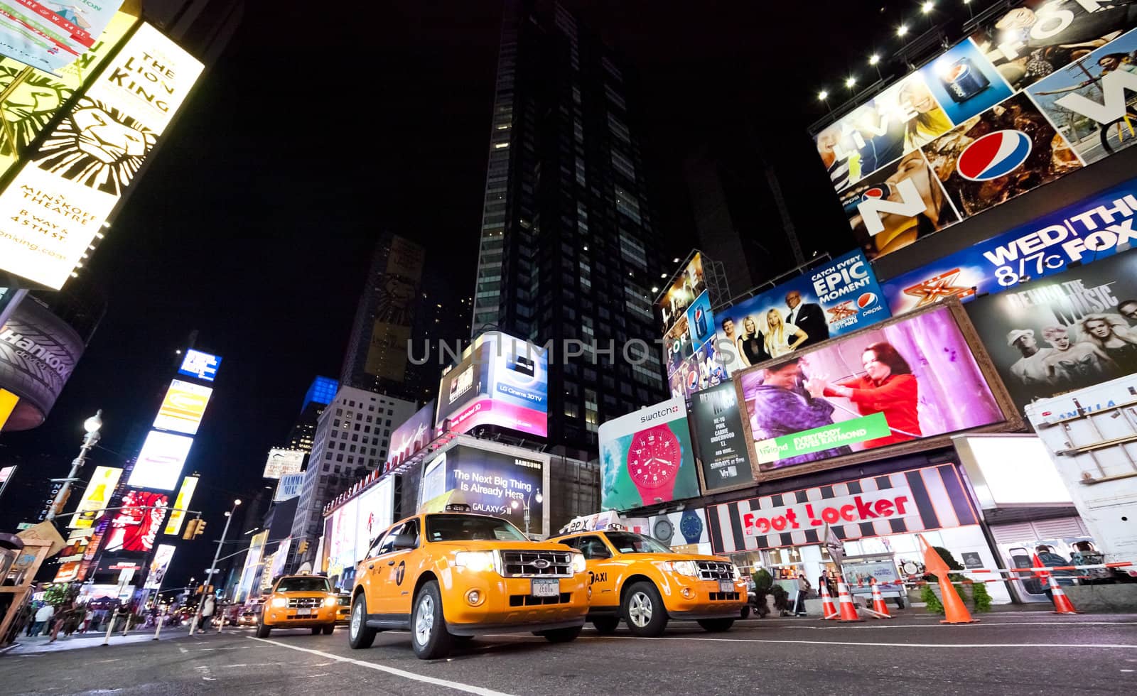 NEW YORK CITY - SEPT 18: Times Square, featured with Broadway Theaters, Taxi Cabs and animated LED signs, is a symbol of New York City and the United States, September 18, 2012 in Manhattan, New York City