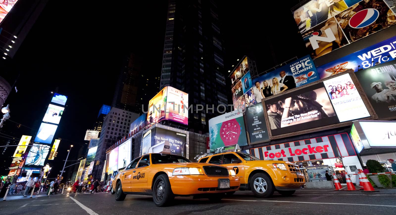 NEW YORK CITY - SEPT 18: Times Square, featured with Broadway Theaters, Taxi Cabs and animated LED signs, is a symbol of New York City and the United States, September 18, 2012 in Manhattan, New York City