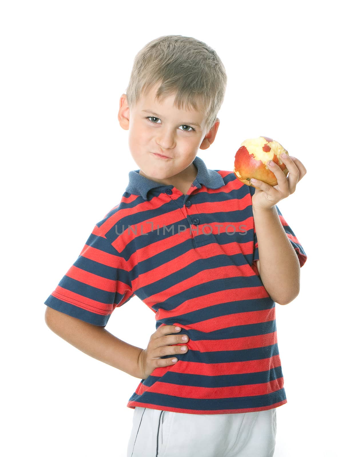Boy holding an apple isolated on white background