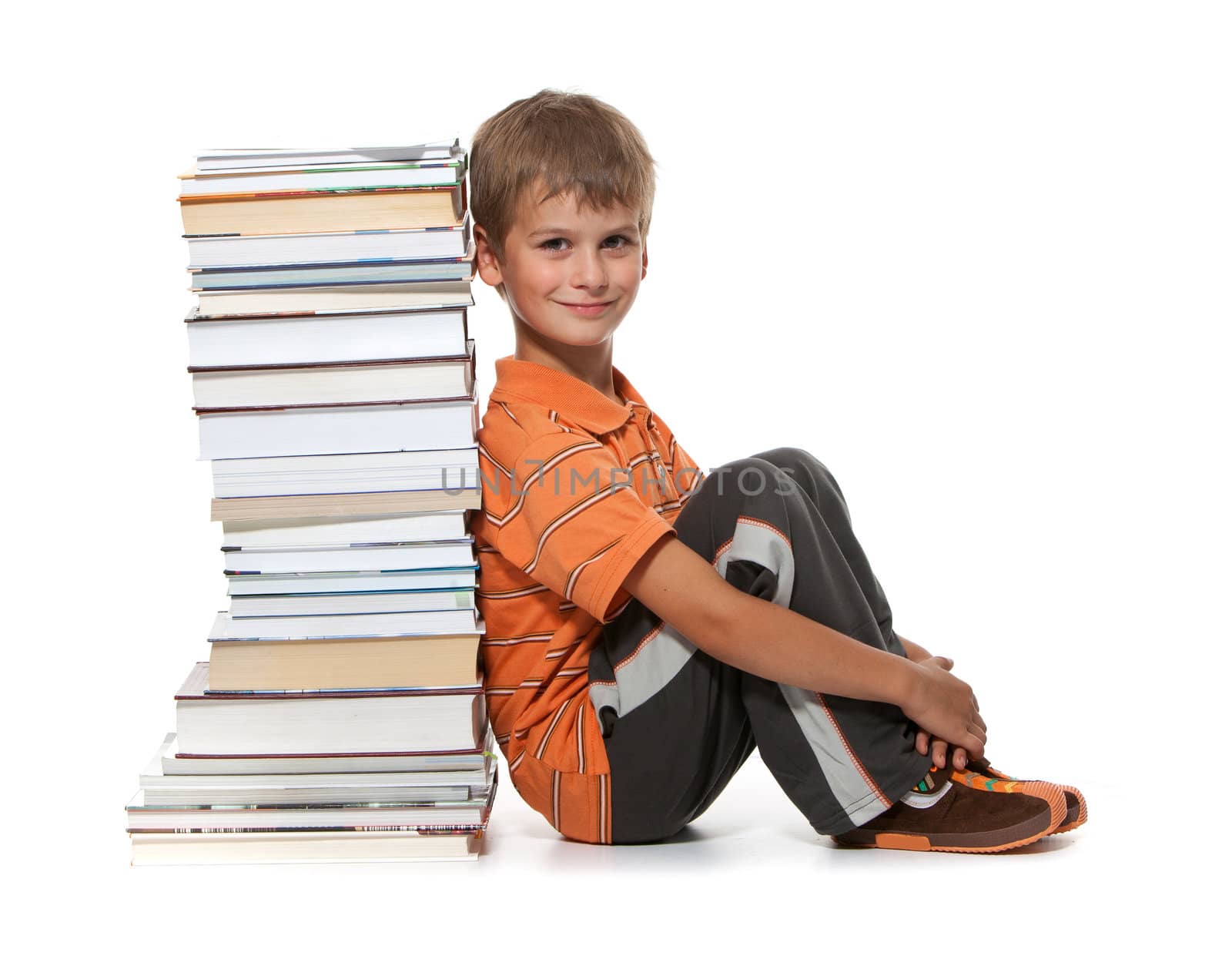 Boy and books isolated on a white background