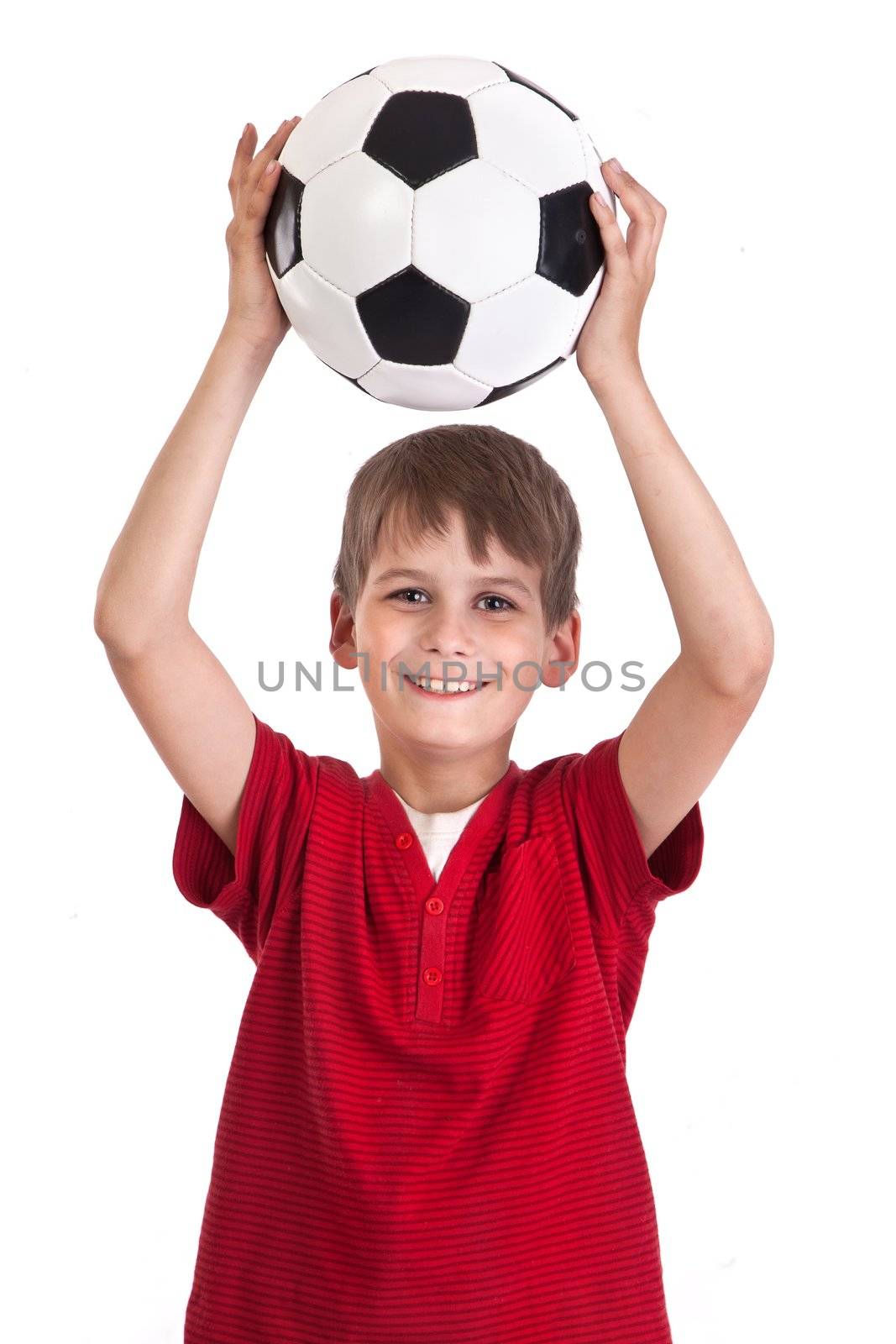 Cute boy is holding a football ball made of genuine leather isolated on a white background. Soccer ball