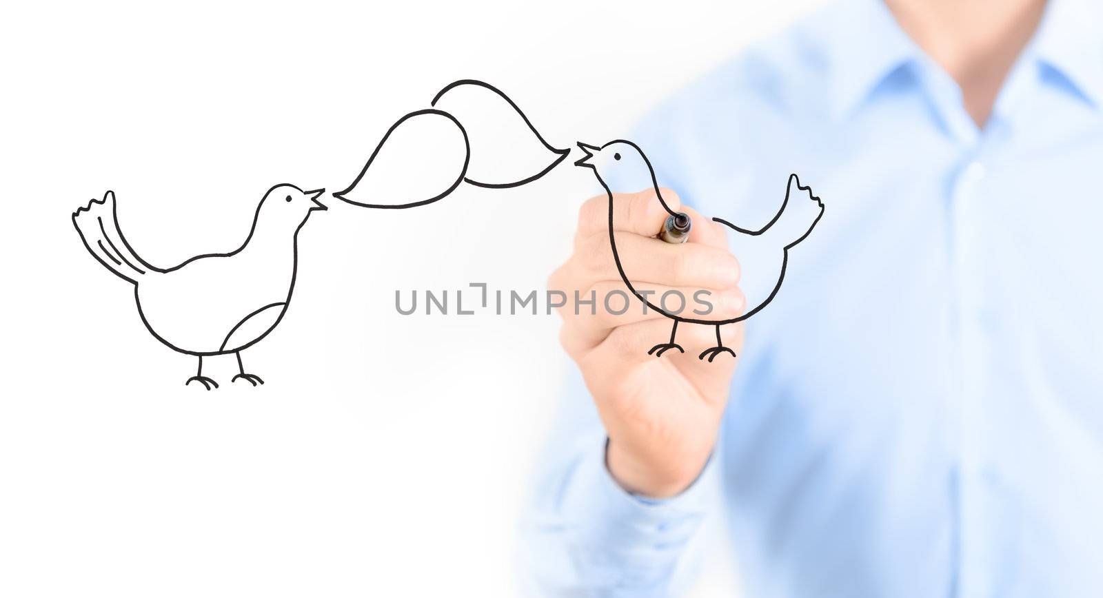 Young businessman drawing social media chatting concept. Isolated on white.