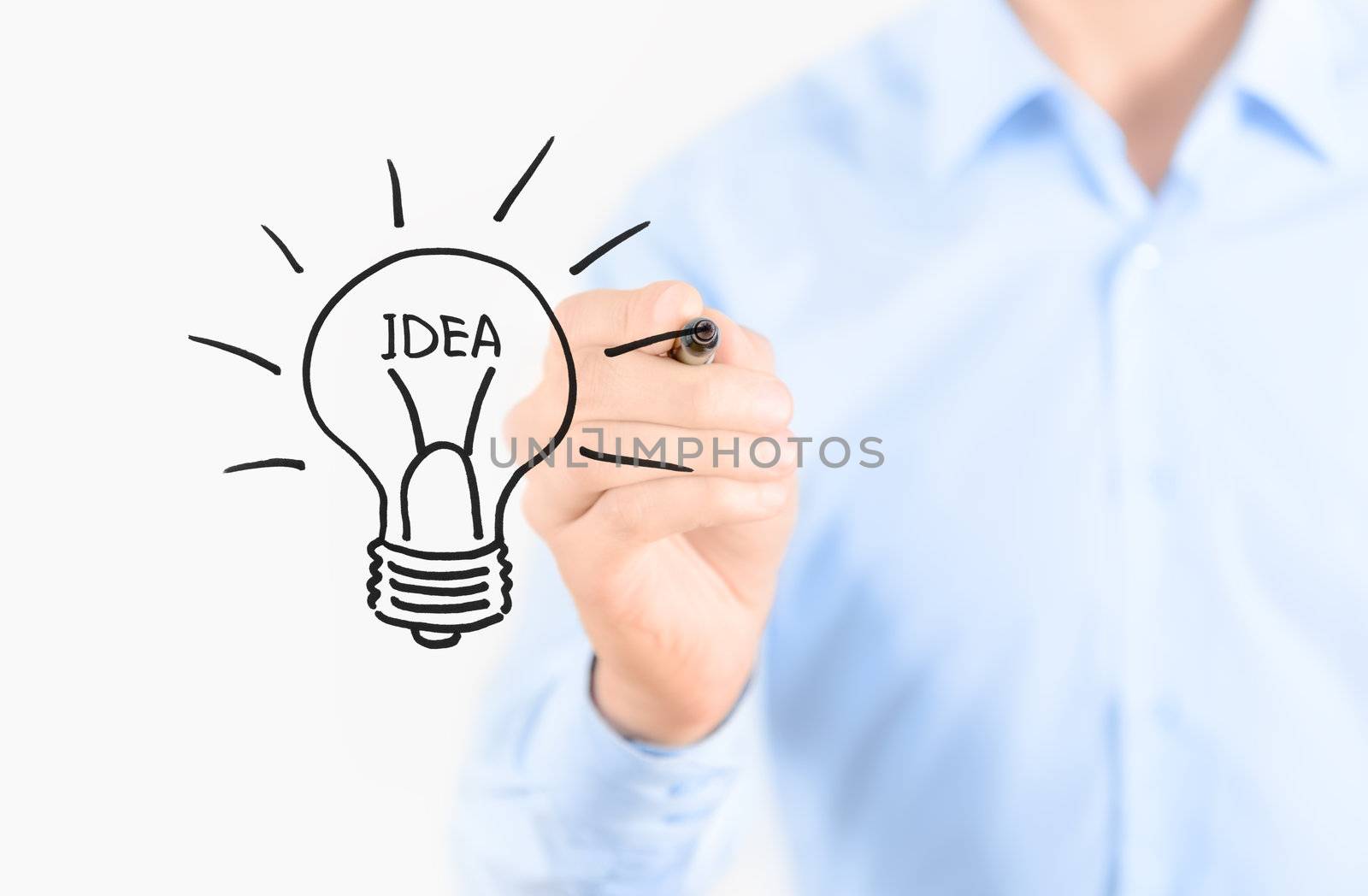 Young businessman drawing idea concept. Isolated on white.