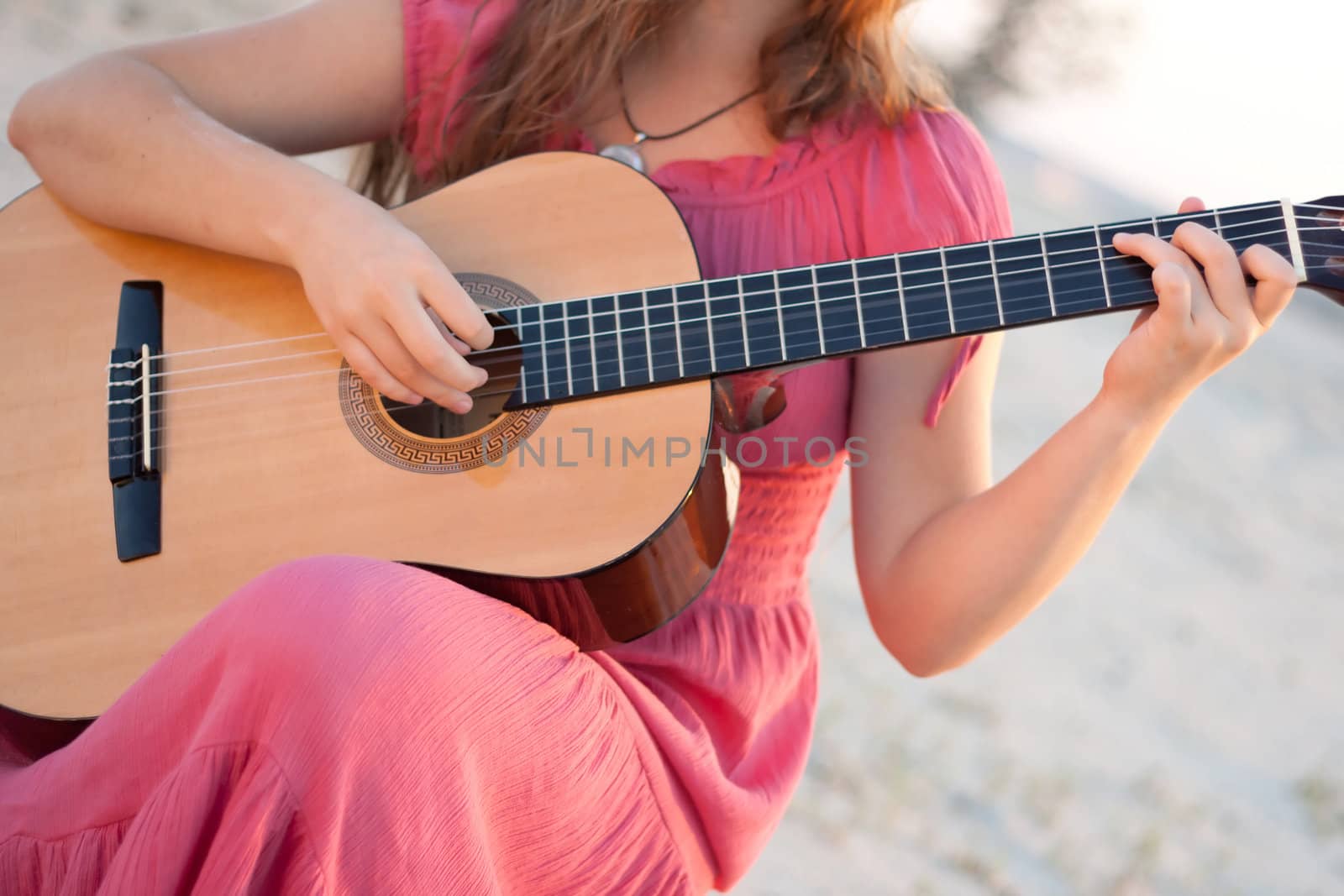 A girl in a dress playing a guitar  by victosha