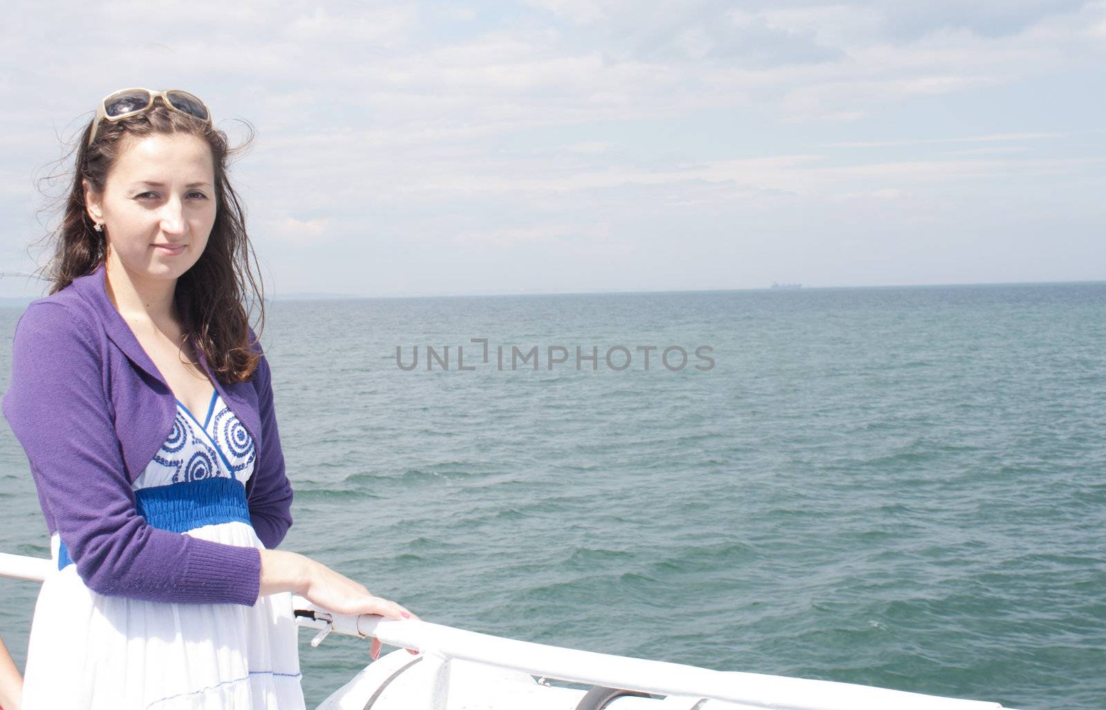 A girl riding on a ship at sea species in nature photography