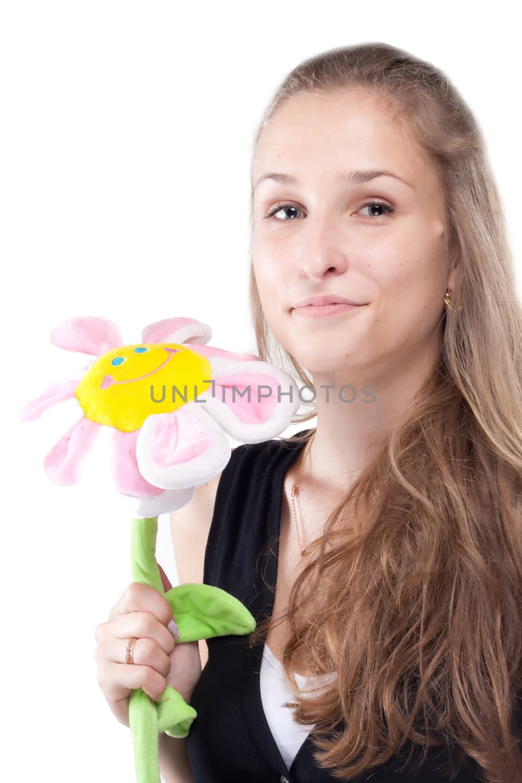 Portrait of a beautiful girl with long hair plush flower studio shooting