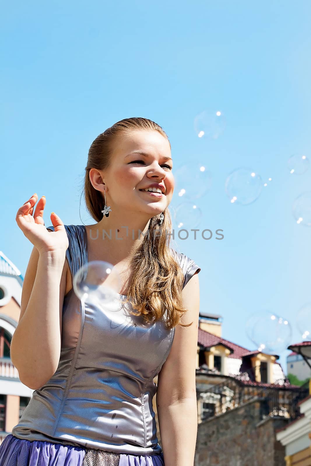 Girl with soap bubbles in the sky  by victosha