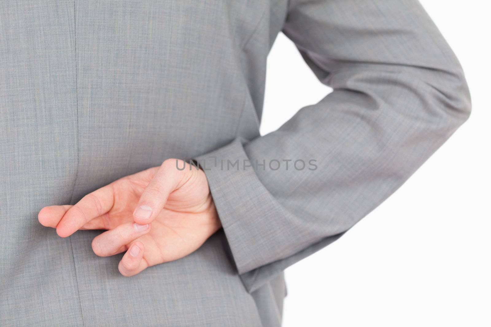 Masculine fingers crossed against a white background
