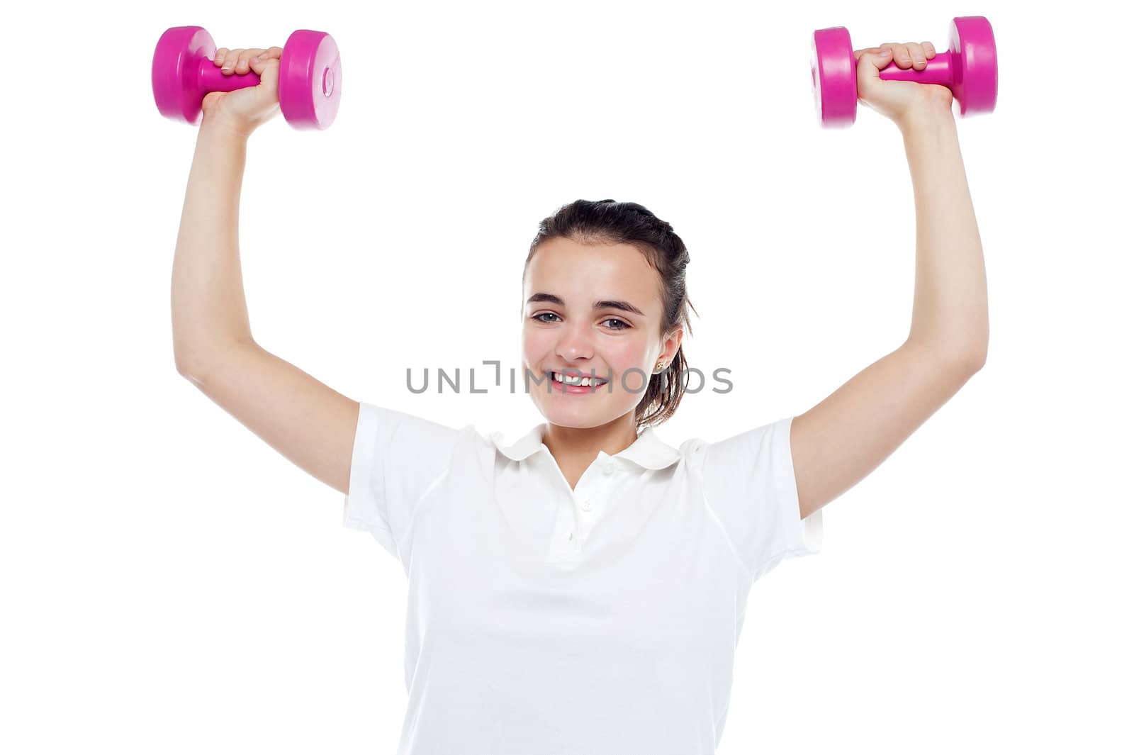 Smiling girl working out. Dumbbells above her head. All against white background