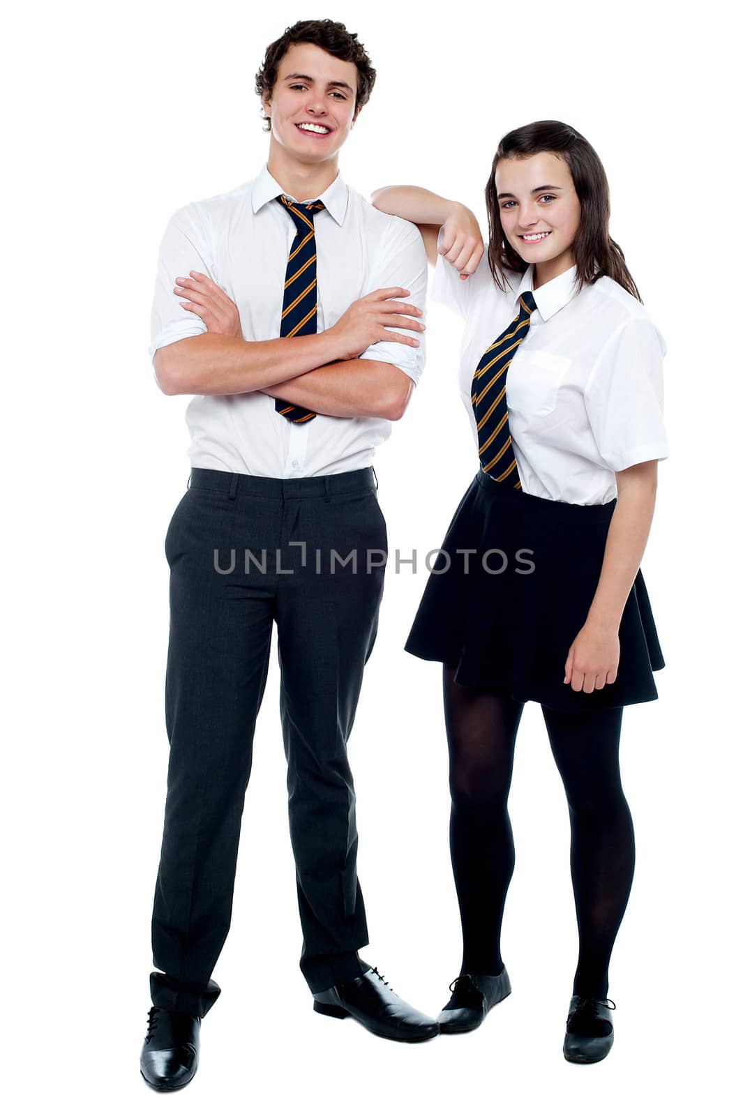 School girl resting hand on her classmates shoulder. Full length portrait