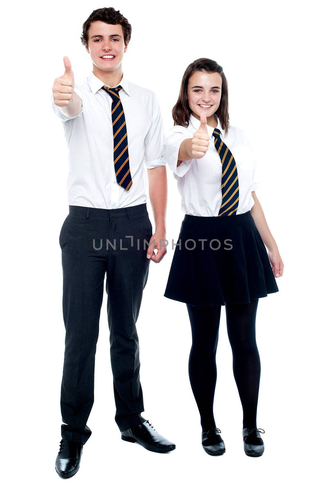 Yes! we made it. School friends gesturing thumbs up after the announcement of results