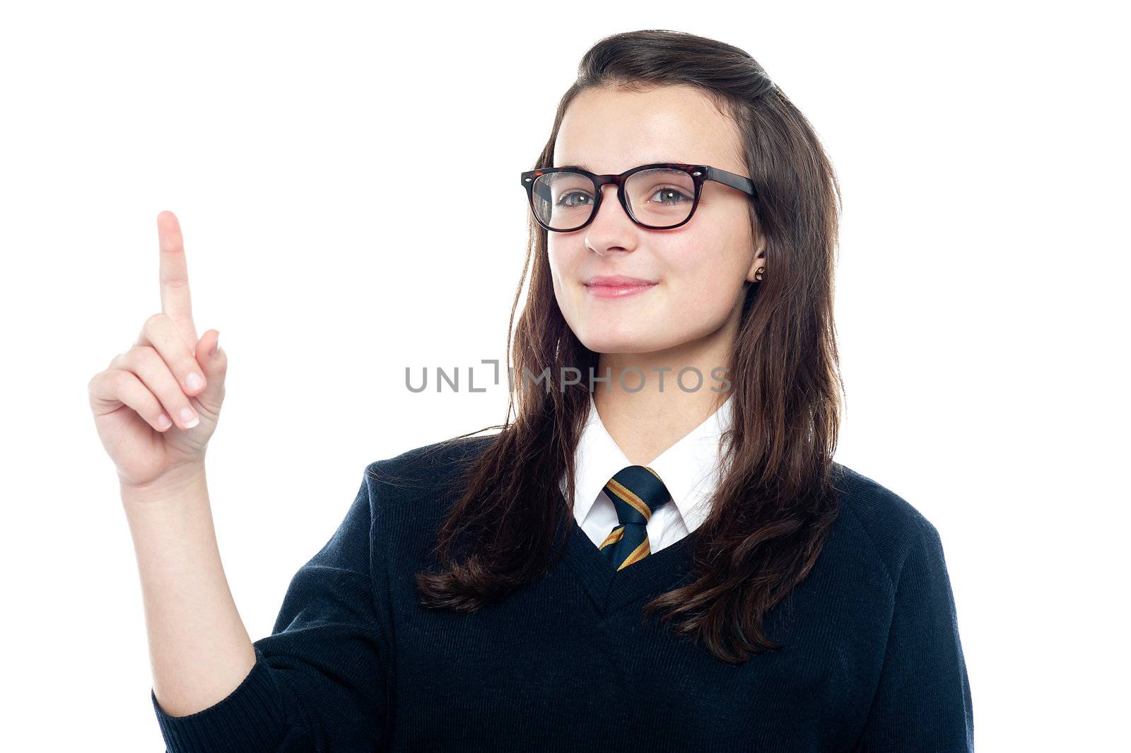 Smart girl raises her finger to draw the attention of class teacher