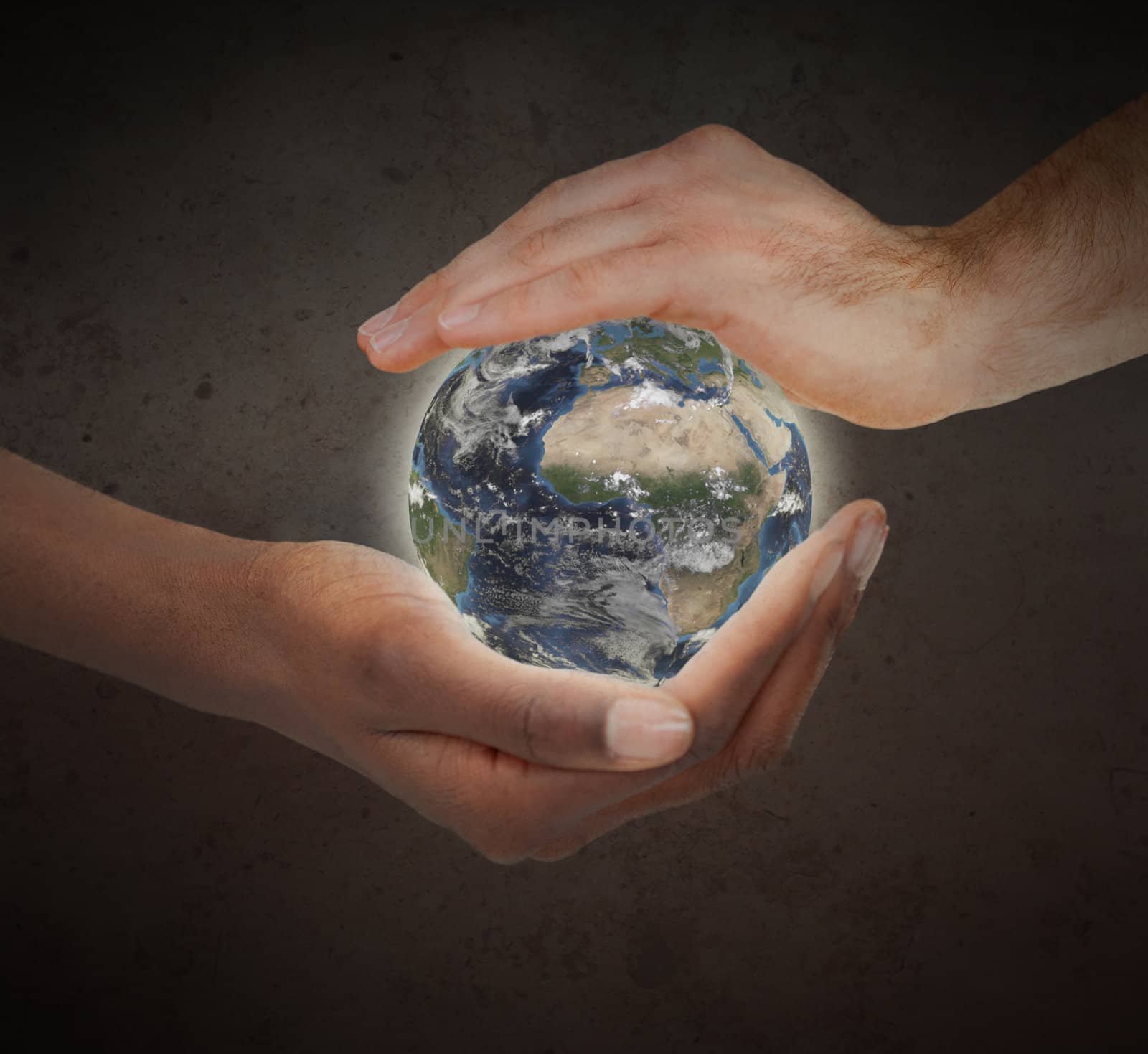 Two hands protecting a glowing planet globe against a white background