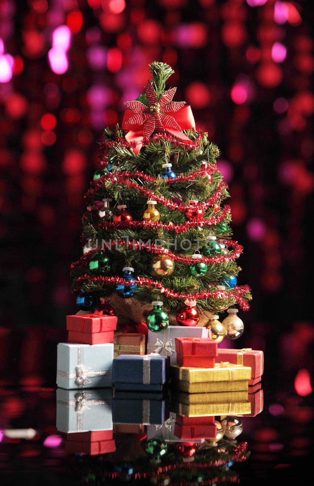 Christmas tree on abstract background with red lights
