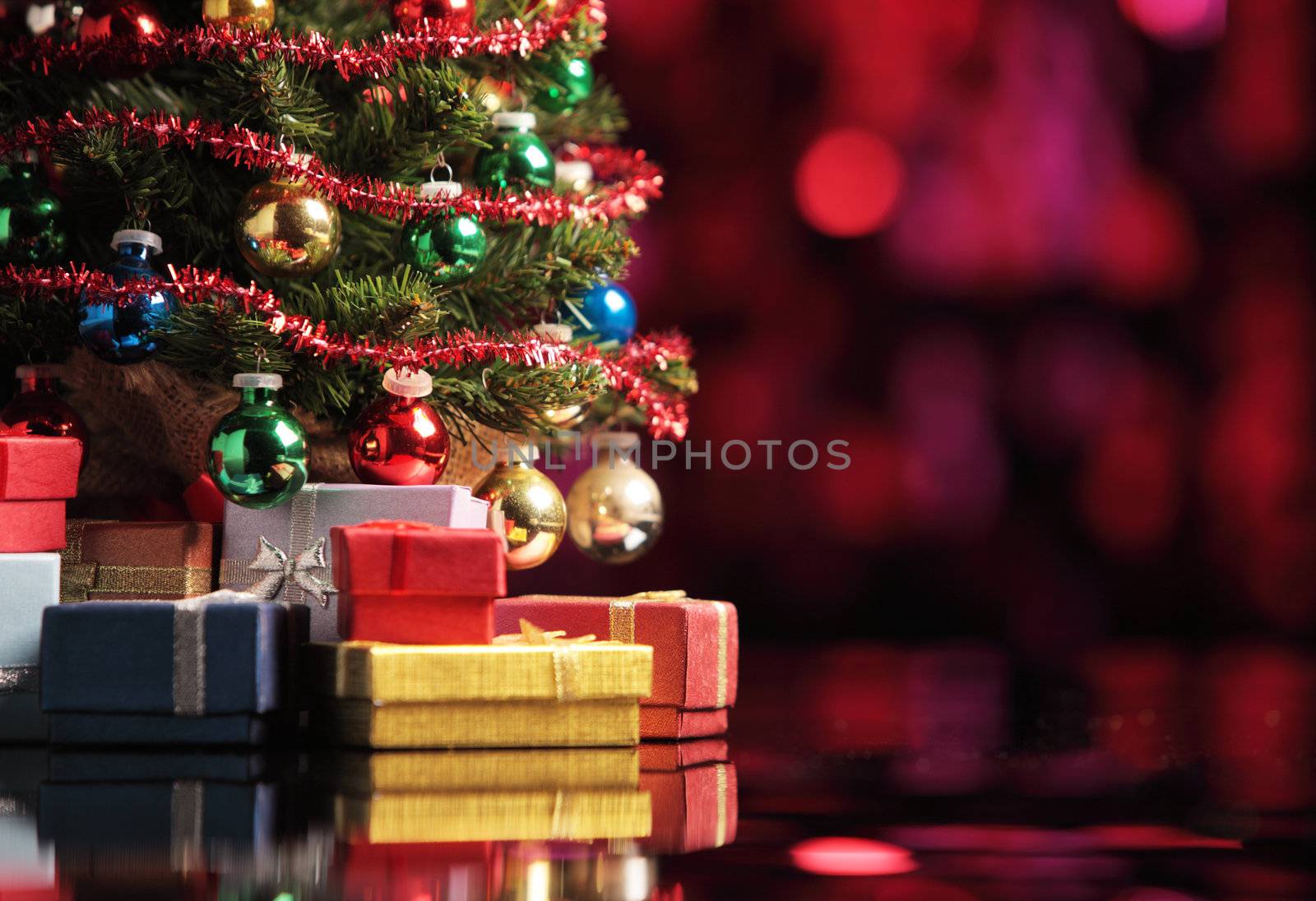 Christmas tree on abstract background with red lights