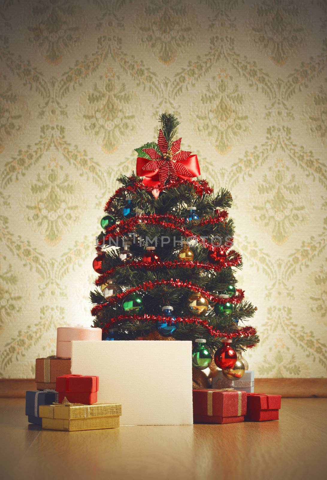 Christmas tree with gifts and greeting card, copy space