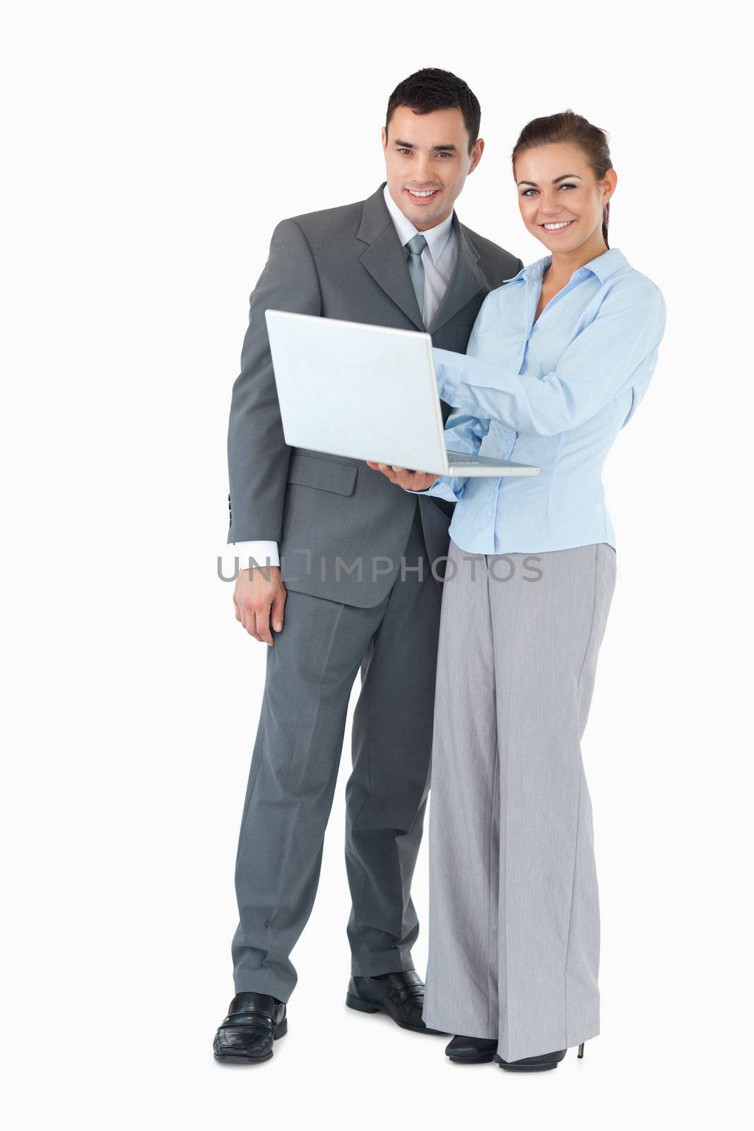 Young business partner with notebook against a white background