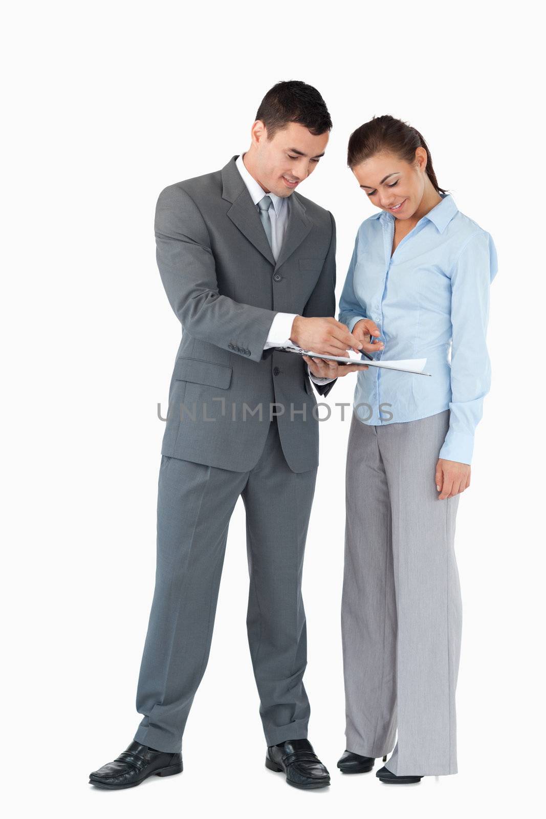 Business partner working on a deal together against a white background