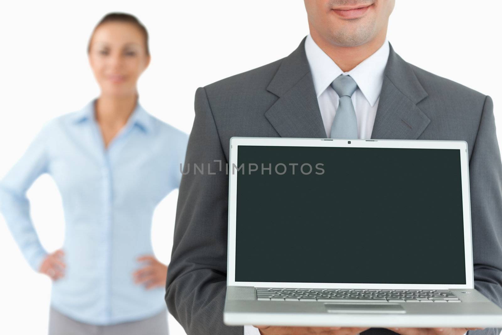Business team with laptop against a white background