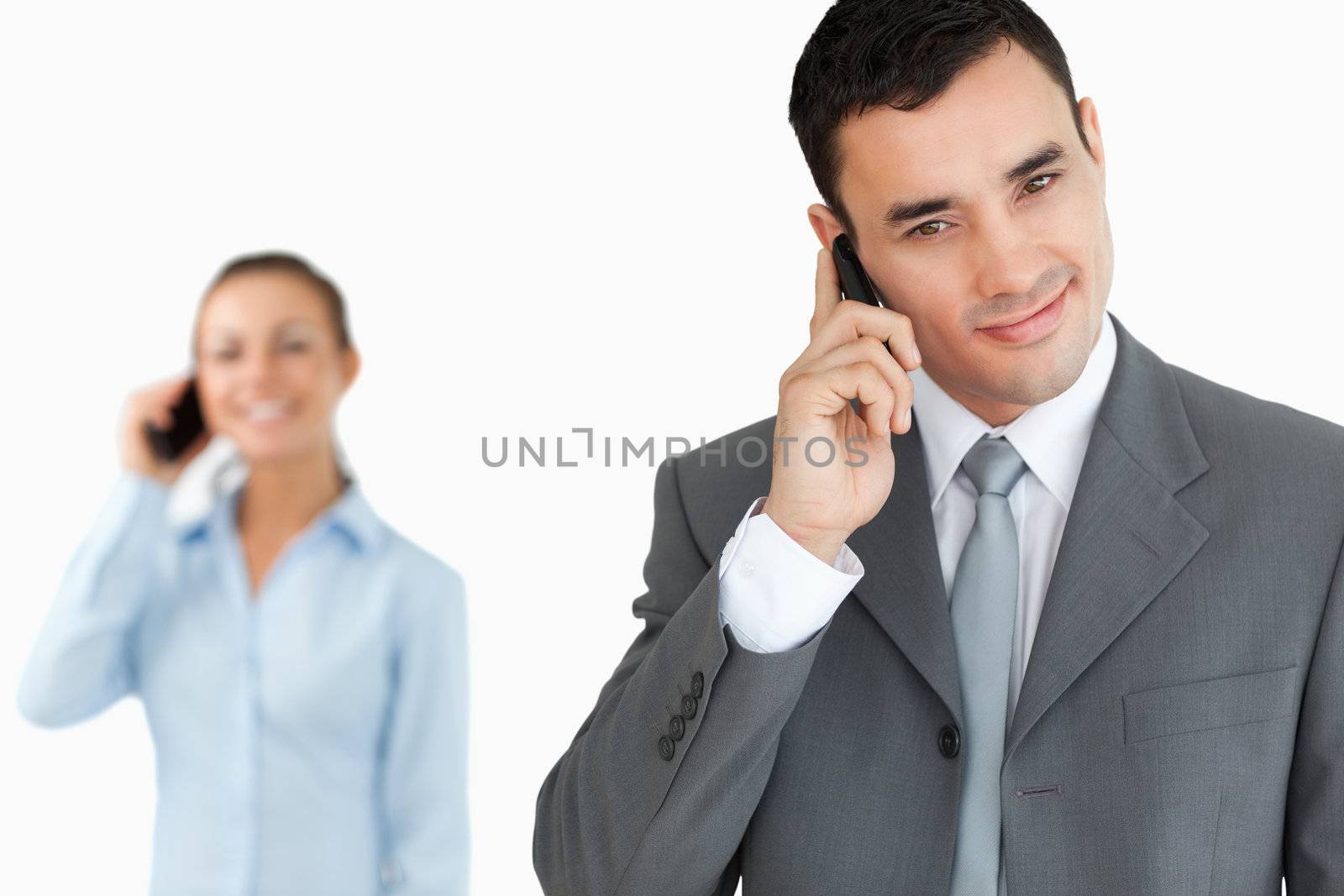 Business partners on the phone against a white background
