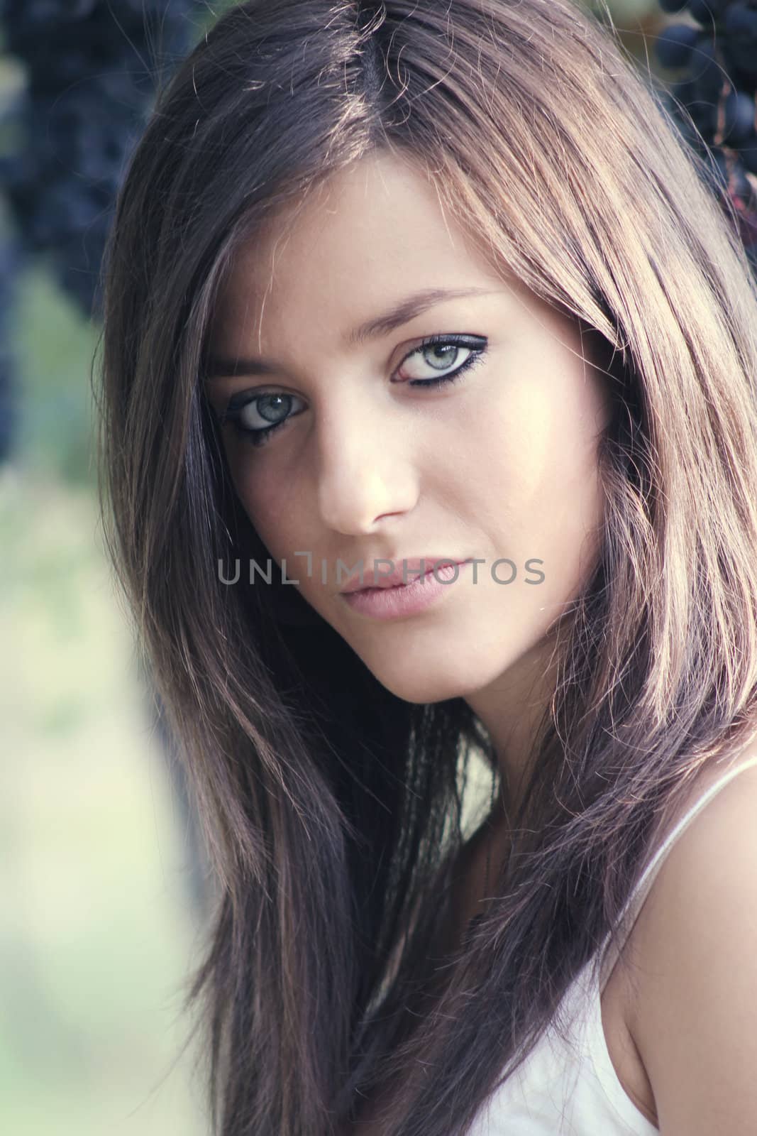 Natural beauty portrait of a young girl with blue eyes . Soft light