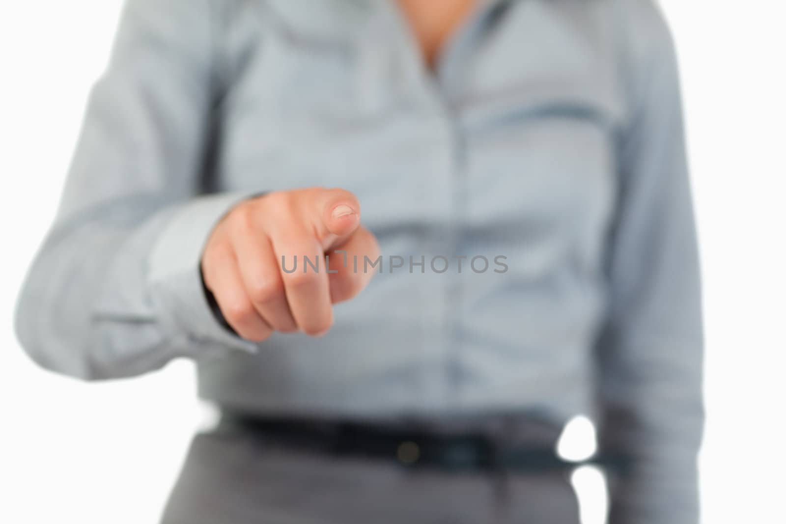 Close up of a businesswoman pressing an invisible key with the camera focus on her hand
