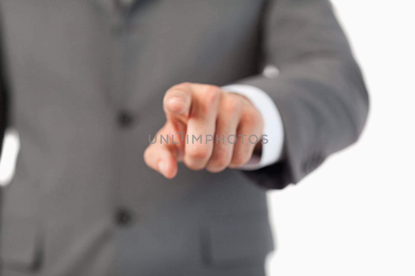 Close up of finger pressing a invisible touchscreen against a white background
