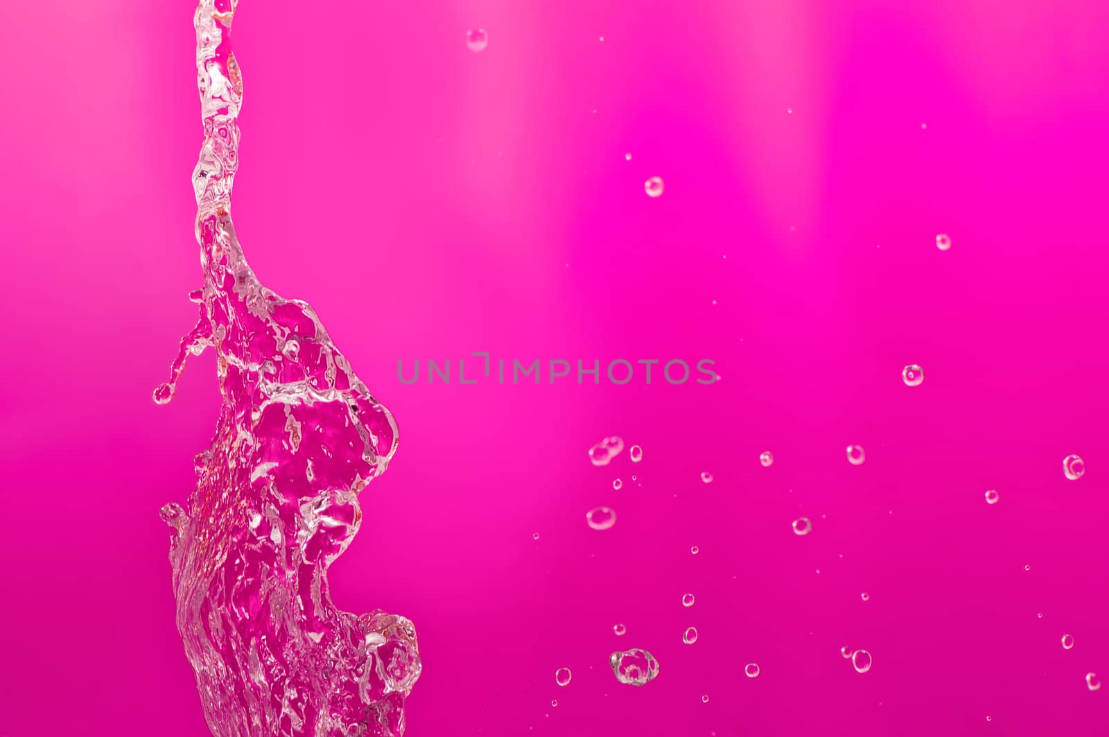 pouring fresh tropical sea water in a glass aquarium