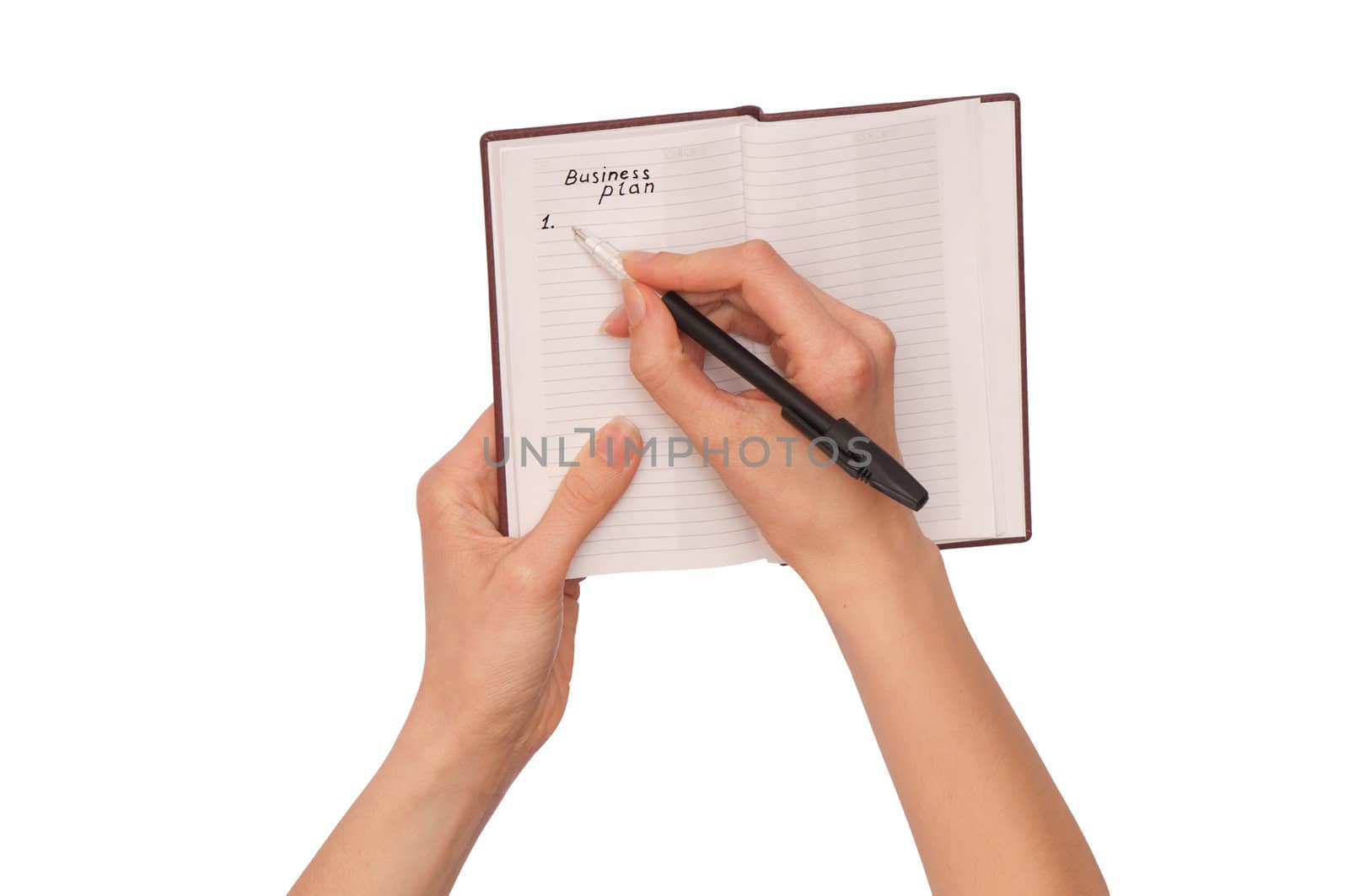 business woman writes notes for business plan