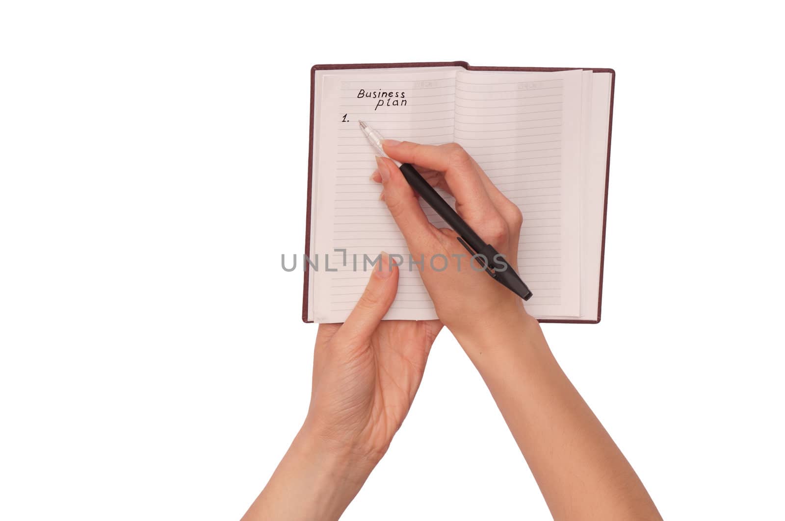 business woman writes notes for business plan