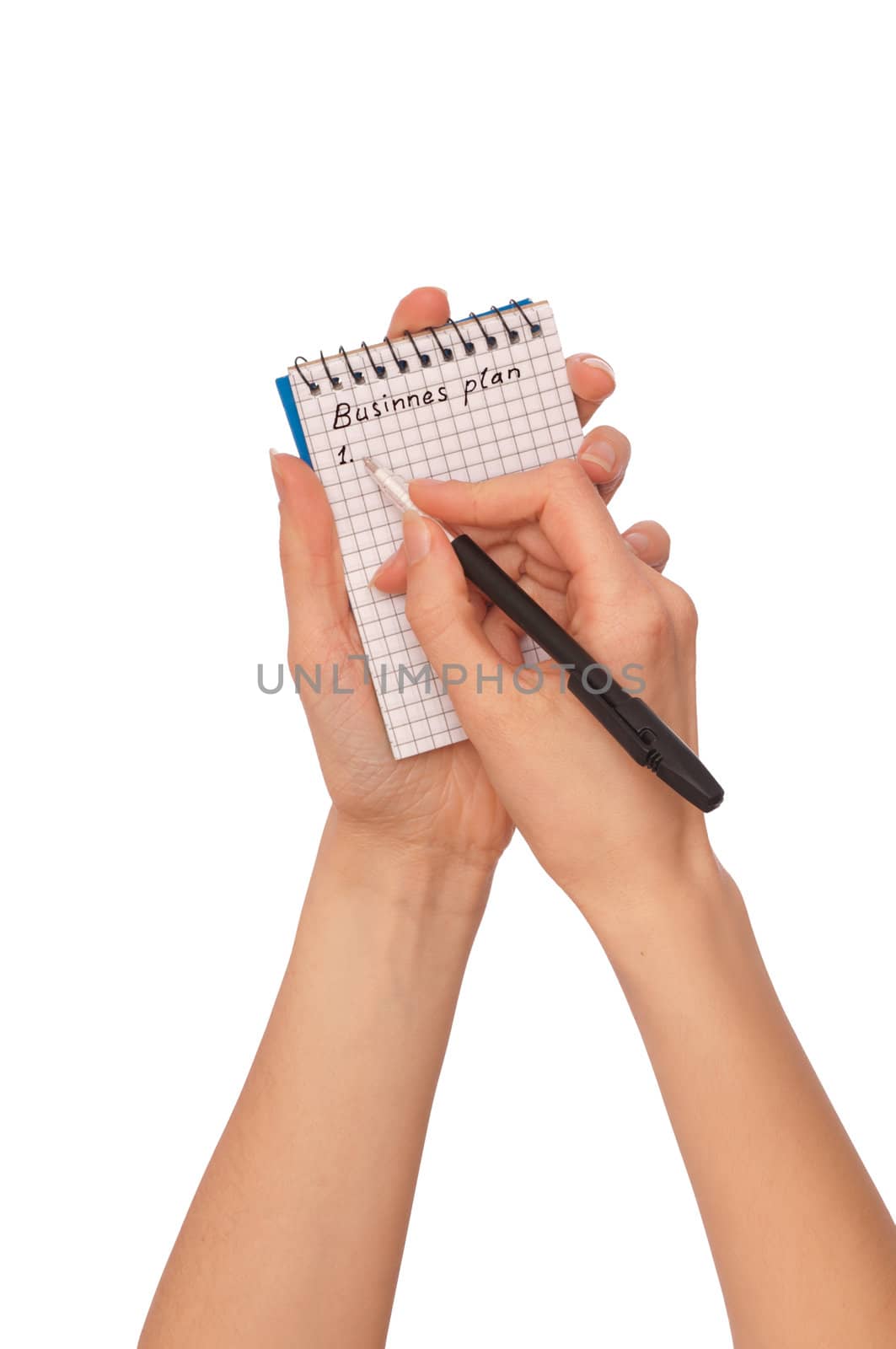 business woman writes notes for business plan