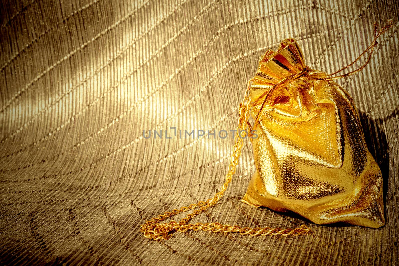gold background, jewelry sack