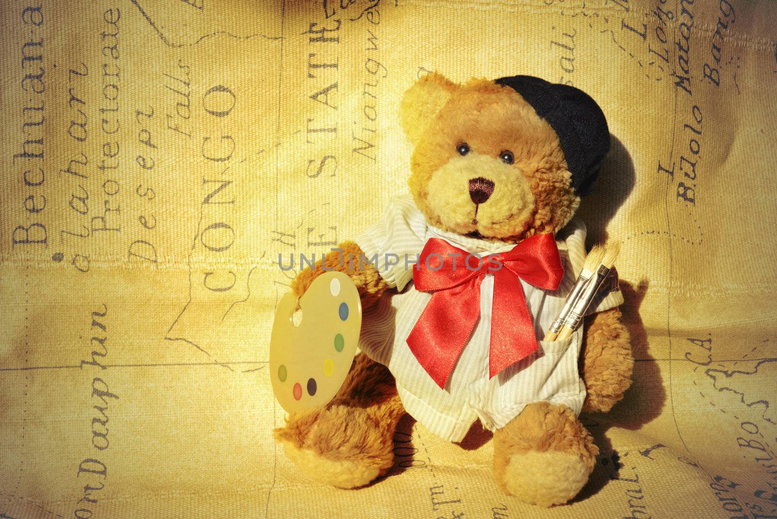 background teddy dressed as a painter with a background map
