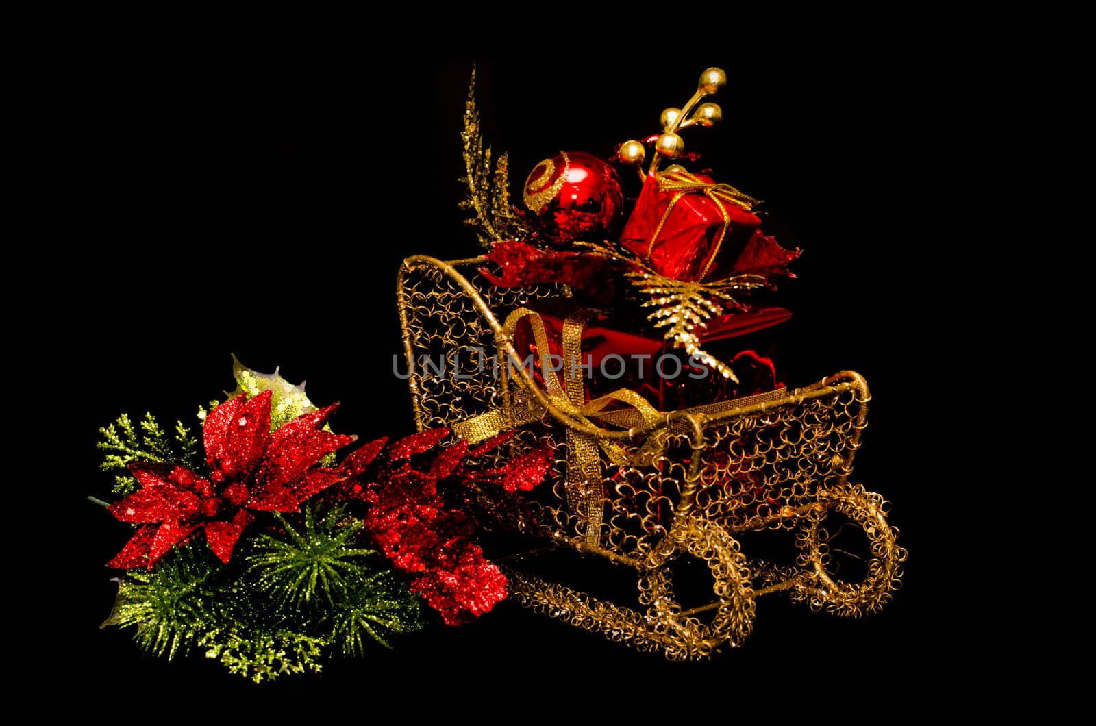 Christmas gift on sleigh on black background.