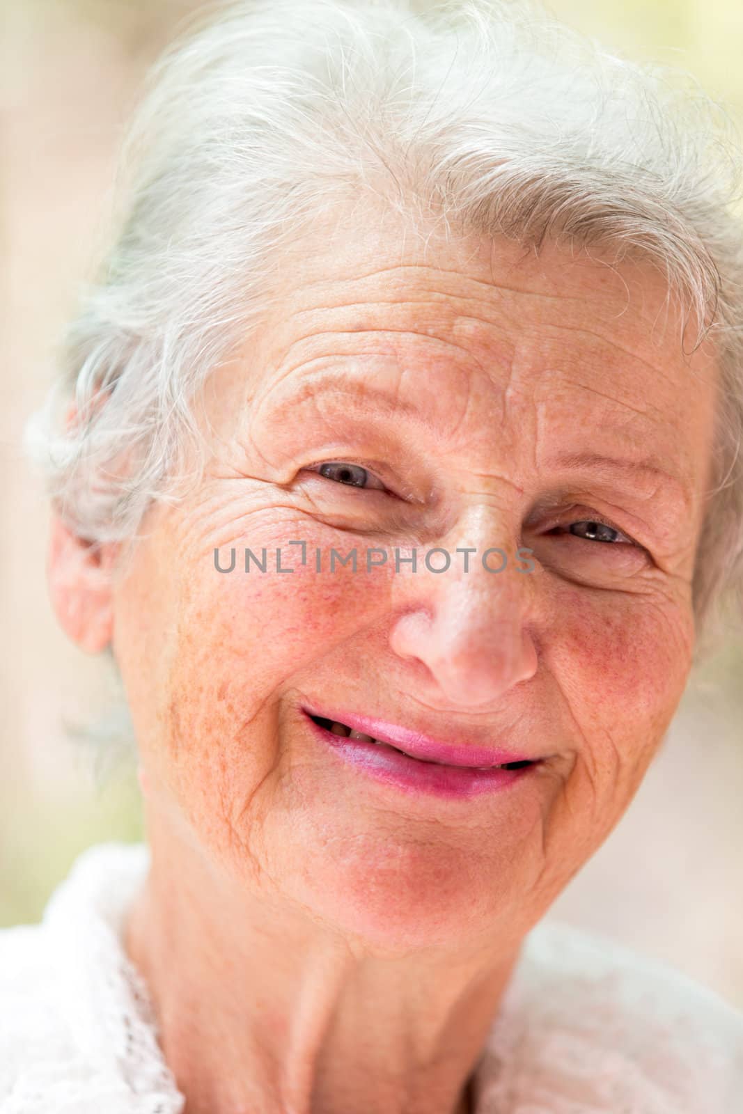 Grandmother is looking at you meaningfully with her white hair.