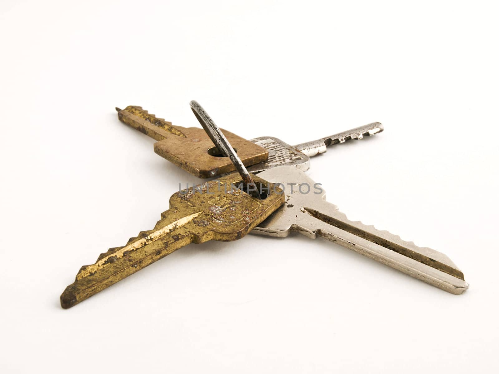 Old rusty keys isolated on white background. Close-up