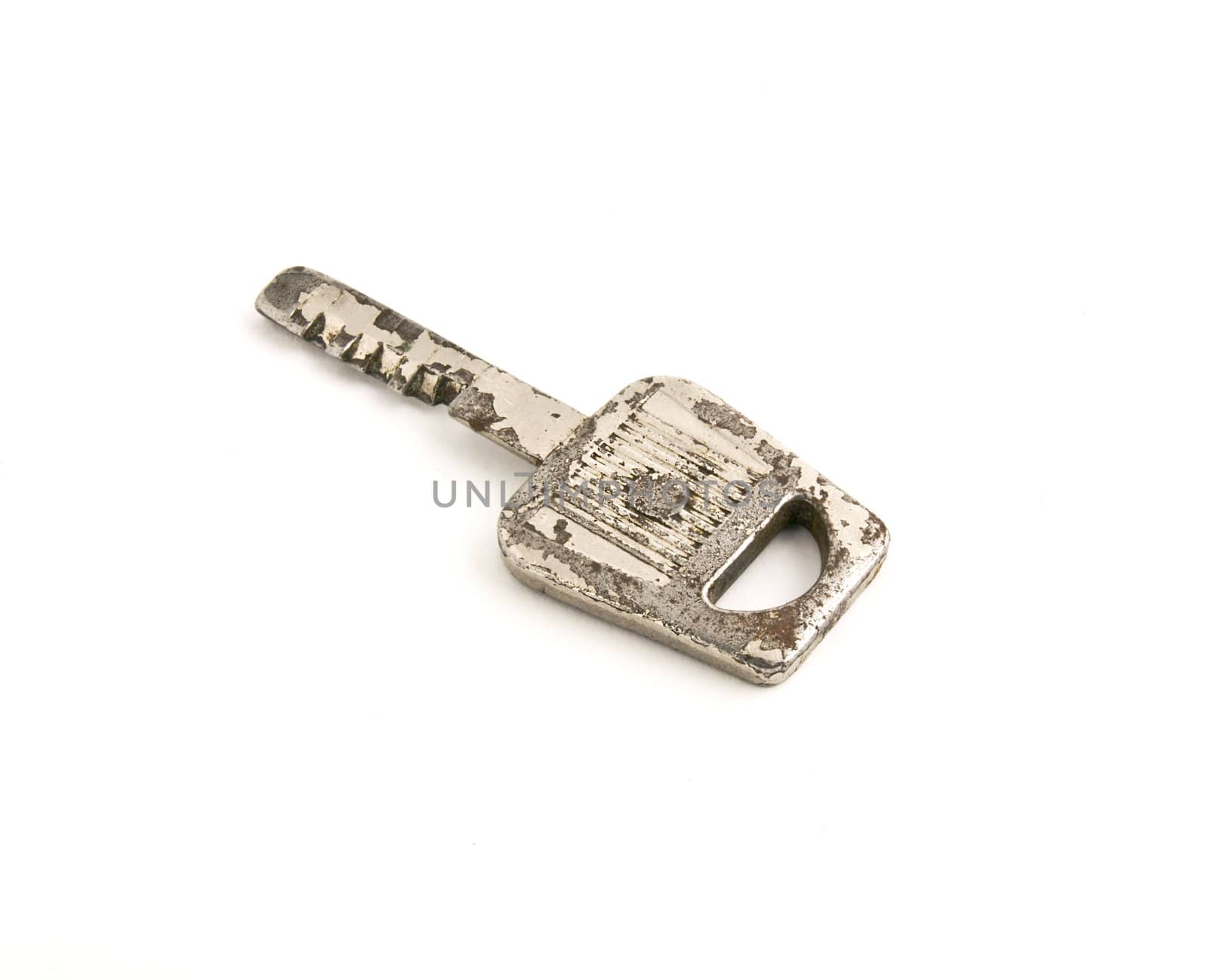 Old rusty key isolated on white background. Close-up