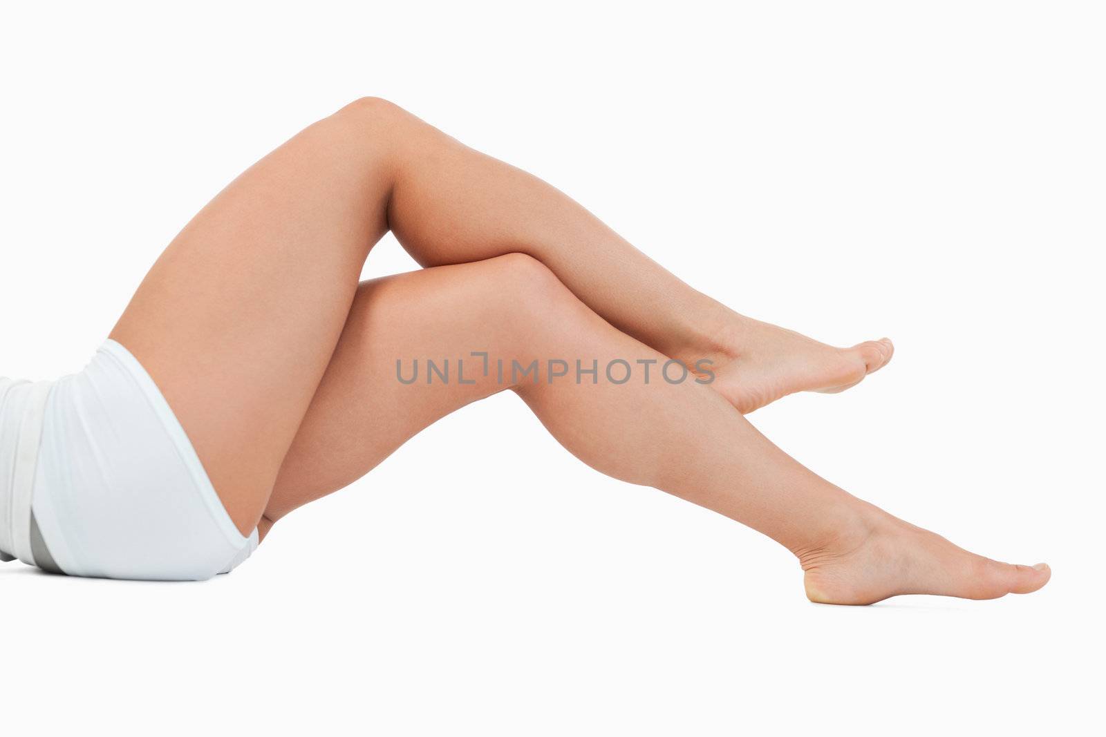 Portrait of crossed legs against a white background